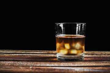 Whiskey on wooden surface