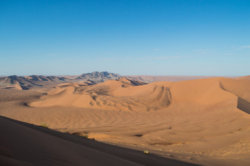 Fototapeta na wymiar Climbing Big Daddy Dune View onto Desert Landscape, Sossusvlei, Namibia