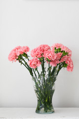Bouquet of carnation in a glass