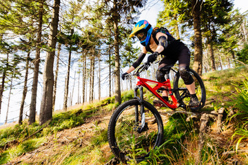 Woman exercise on MTB bike in mountains, woods