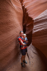 A mother and her baby son visit Lower Antelope canyon in Arizona