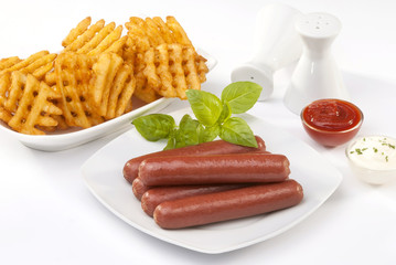 beef franks with mayonnaise ketchup and fries