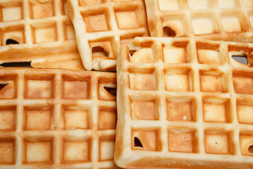 Freshly baked waffles on a white plate