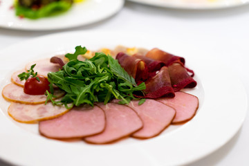 cold meats with rocket leaves