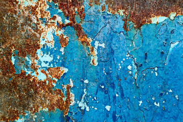 The texture of a rusty metallic blue surface