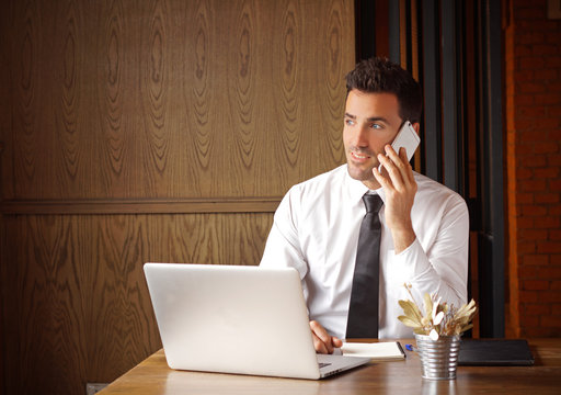 happy entrepreneur on the phone