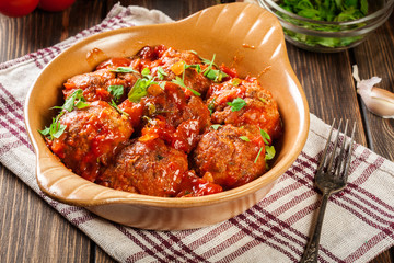 Pork meatballs with spicy tomato sauce in dish