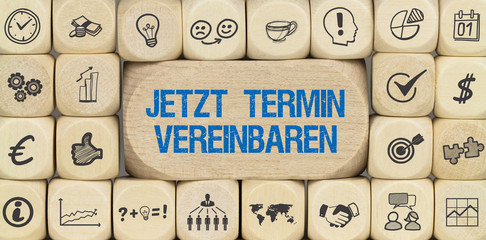 Jetzt Termin vereinbaren / Würfel mit Symbole