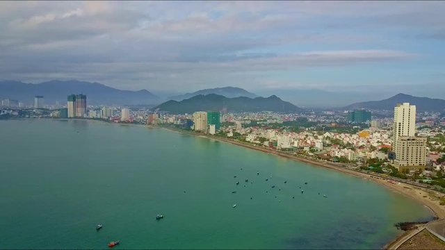Aerial View of City with Skyscrapers on Azure Sea Coast