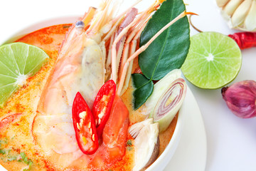 Close up Asian Spicy soup with shrimp in white bowl , famous Thai food cuisine calling Tom Yum Kung