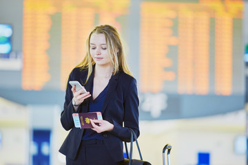 Young business woman in international airport