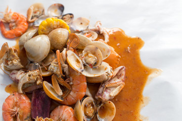 Fried stir spicy sea food for eat on table.