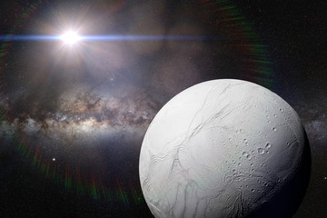 moon Enceladus, satellite of planet Saturn in front of the Milky Way galaxy and the bright Sun