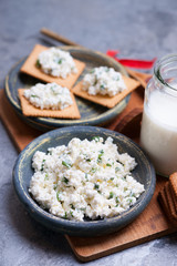 Cracker cookies, cottage cheese and glass of milk 