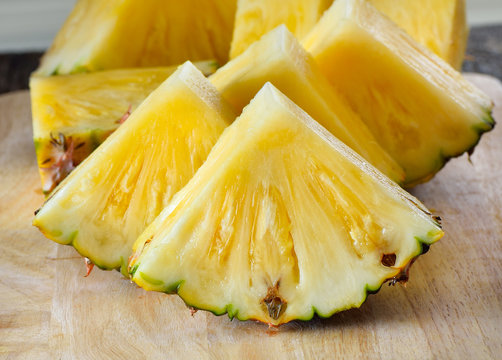 pineapple sliced  on wooden background