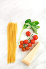 Basic pasta ingredients, including spaghetti and cheese