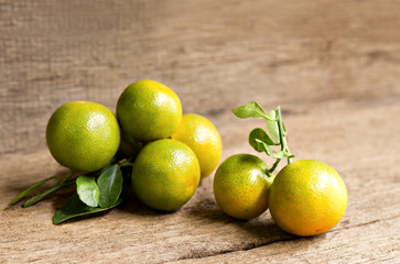 Orange or Citrus Japonica Thunb  on wood table.