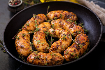 Dietary sausages from turkey fillet and mushrooms in pan