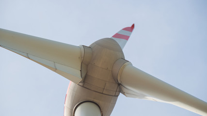 Close up of  wind turbine propeller blades in the blue sky 