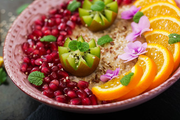 Tasty and healthy oatmeal porridge with fruit, berry and flax seeds. Healthy breakfast. Fitness food. Proper nutrition.