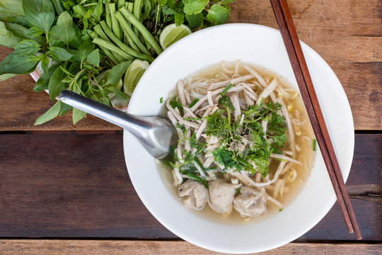 Vietnamese noodle (pho) on wooden table