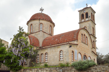 Fototapeta na wymiar Orthodox church with purple lilac