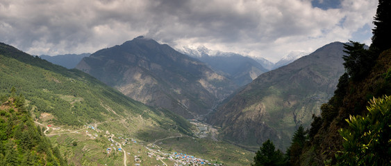 Fototapeta na wymiar Mountain Panorama with Town in Valley