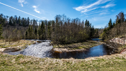 Fototapeta na wymiar scenic spring colored river in country