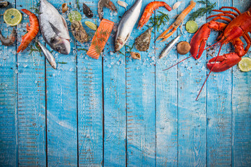 Fresh tasty seafood served on old wooden table.