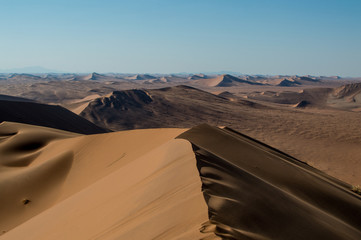 Fototapeta na wymiar Summit of Big Daddy Dune View onto Desert Landscape, Sossusvlei, Namibia