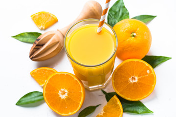 Orange juice in glass on white.