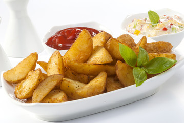 Fried potato wedges with coleslaw & ketchup with basil leaf  