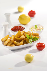 Fried potato wedges with coleslaw & ketchup with basil leaf  