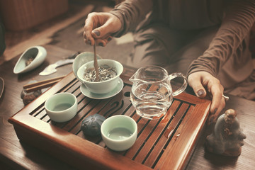 Fototapeta na wymiar young beautiful blonde woman making tea ceremony