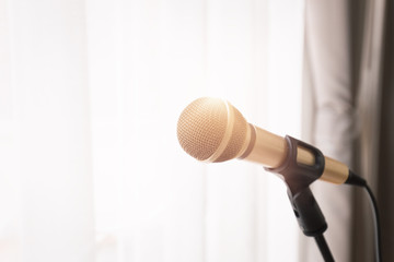 Fototapeta premium Microphone with bright light from window