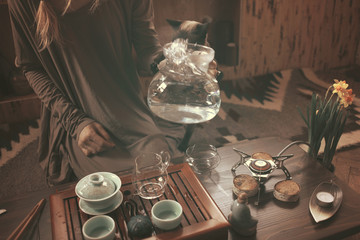 young beautiful blonde woman making tea ceremony