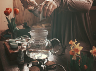 young beautiful blonde woman making tea ceremony