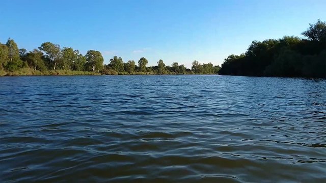 Fast moving water. View from canoe looking back on Vaal River in South Africa. Border North West Provice and Free state