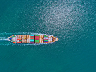 container ship in import export and business logistic.By crane ,Trade Port , Shipping, cargo to...