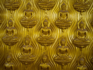 Golden buddha on wall background,