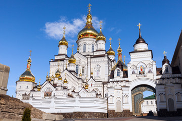 orthodox church with golden domes, Trinity cathedral and bell tower in Pochaev Lavra (Pochayiv Lavra), Ukraine