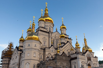 Fototapeta na wymiar orthodox church with golden domes, Trinity cathedral and bell tower in Pochaev Lavra (Pochayiv Lavra), Ukraine
