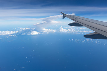 Fototapeta premium Above the clouds.Wing aircraft on the sky