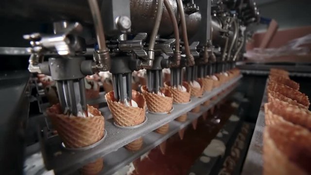 Close-up shooting of the ice-cream cones' filling. HD.