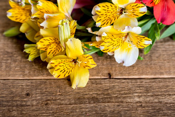 alstroemelias flowers on the wood