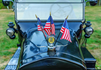 1924 Ford Model T Detail with Three American Flags / Essex, USA - August 2, 2011: 1924 Ford Model T...