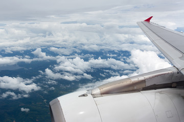   Above the clouds.Wing aircraft on the sky