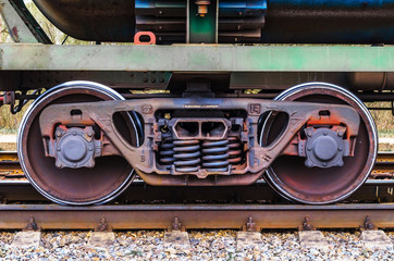 Naklejka premium Industrial rail train wheels closeup technology train rail road.