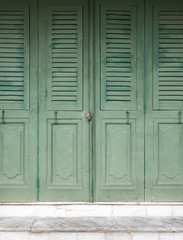 Wooden folding doors with the small lock.
