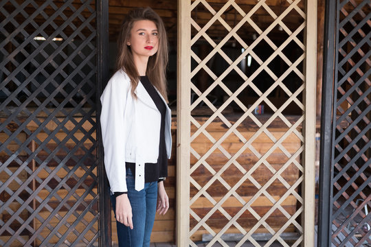 Attractive young woman in a white jacket